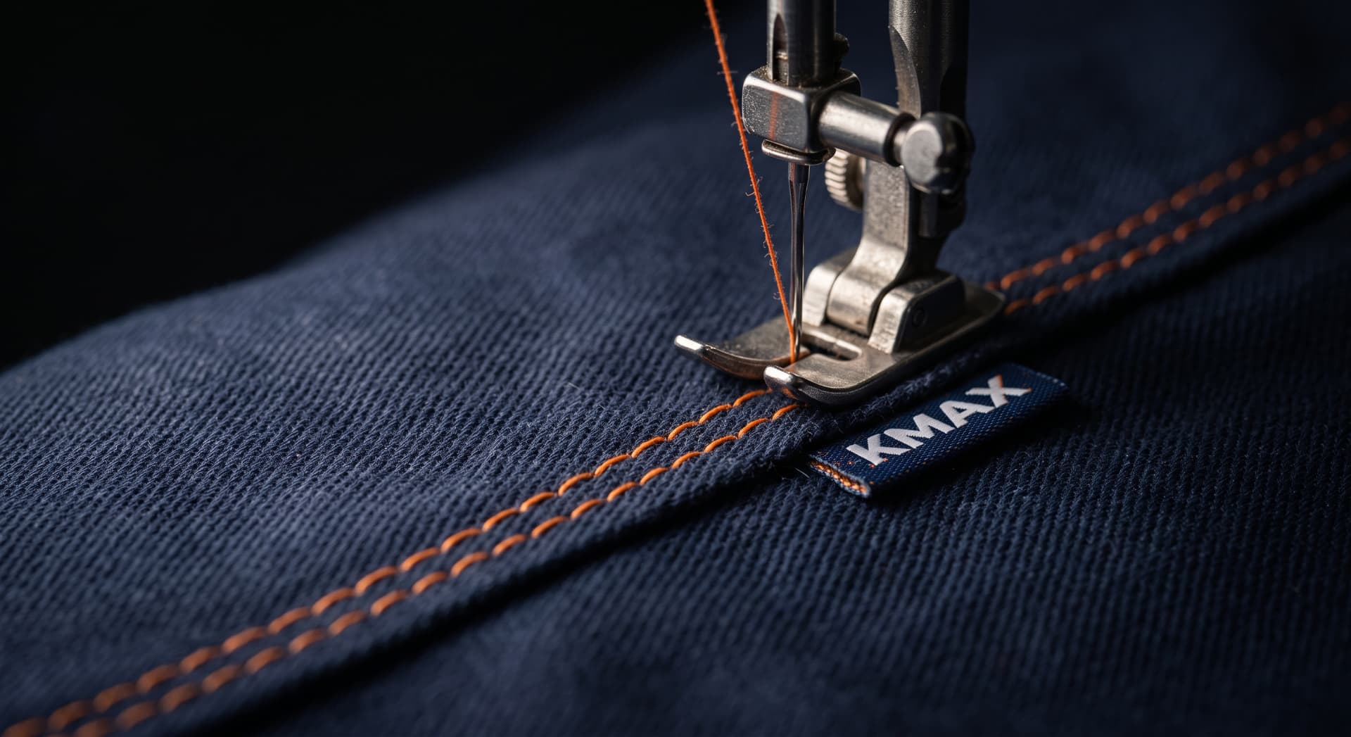 Triple orange contrast stitching on navy fabric